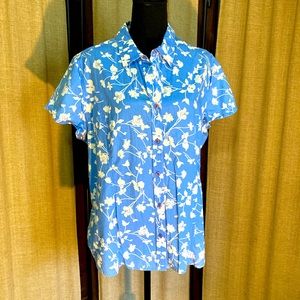 Blue button up shirt with white flowers. By Kim rogers. Size 1x. Short sleeve.